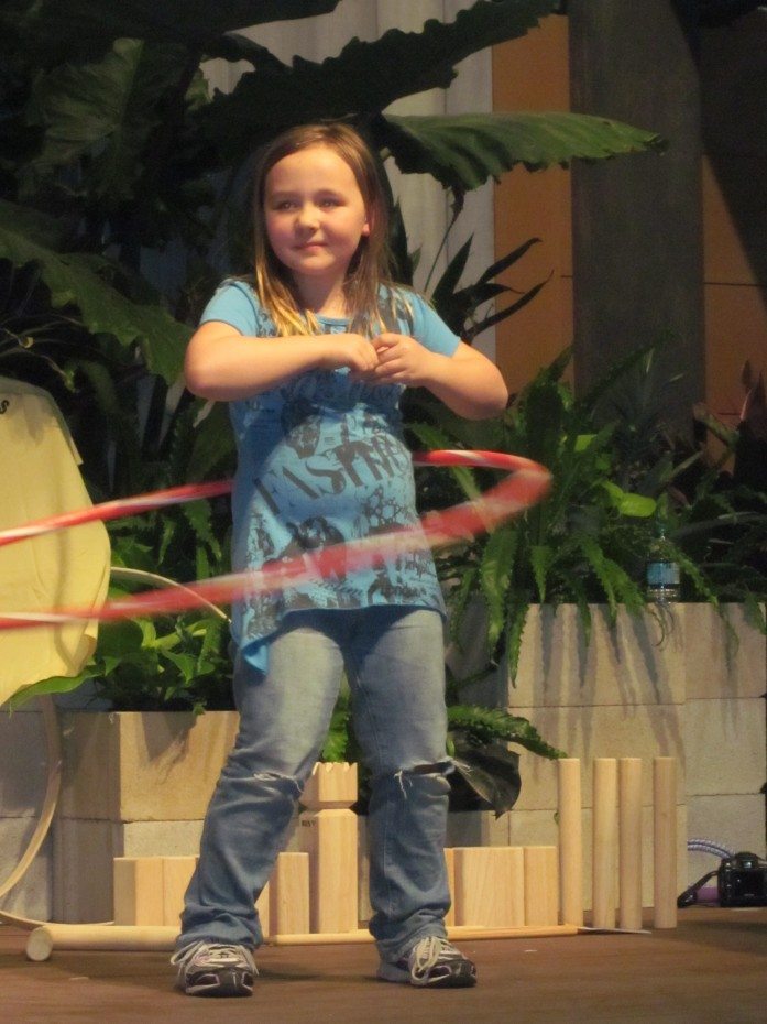 Philadelphia Flower Show Pictures kid participates in hula hoop contest.