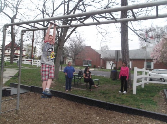 My son at Albertson Memorial Park on the Monkey Bars