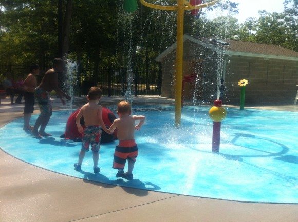 My Oldest showing his brother all of the water features at Bridgeton's new Splash Pad.