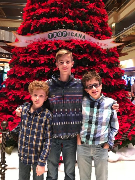 Boys with large red poinsettia tree at Tropicana Atlantic City