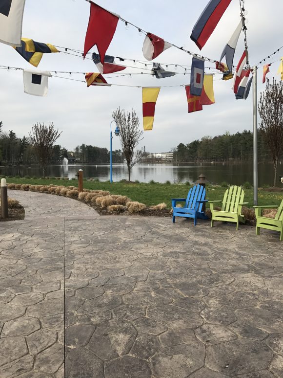 Regatta Playground in West Orange NJ seating area near water with flags