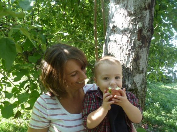 mother and son enjoy an apple from a NJ apple orchard