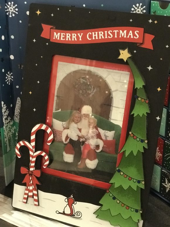 A christms frame for family photos with Santa