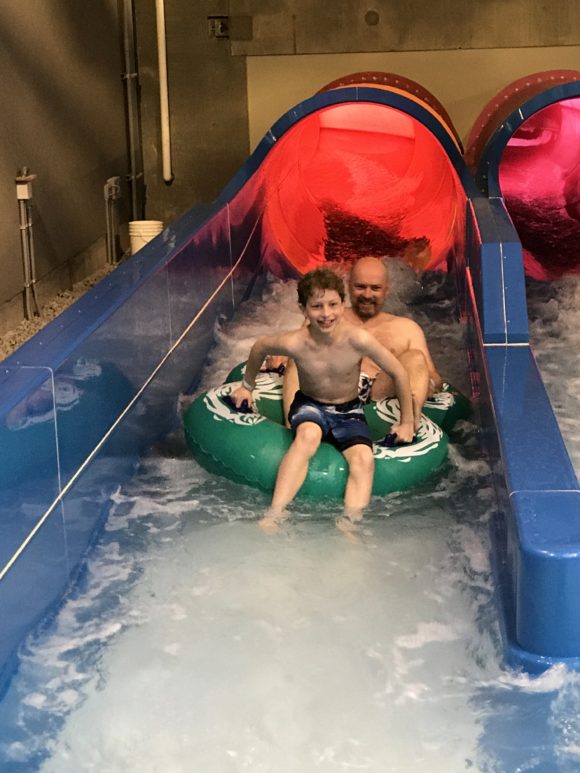 Father and son on a waterslide at The Kartrite Resort & Indoor Waterpark