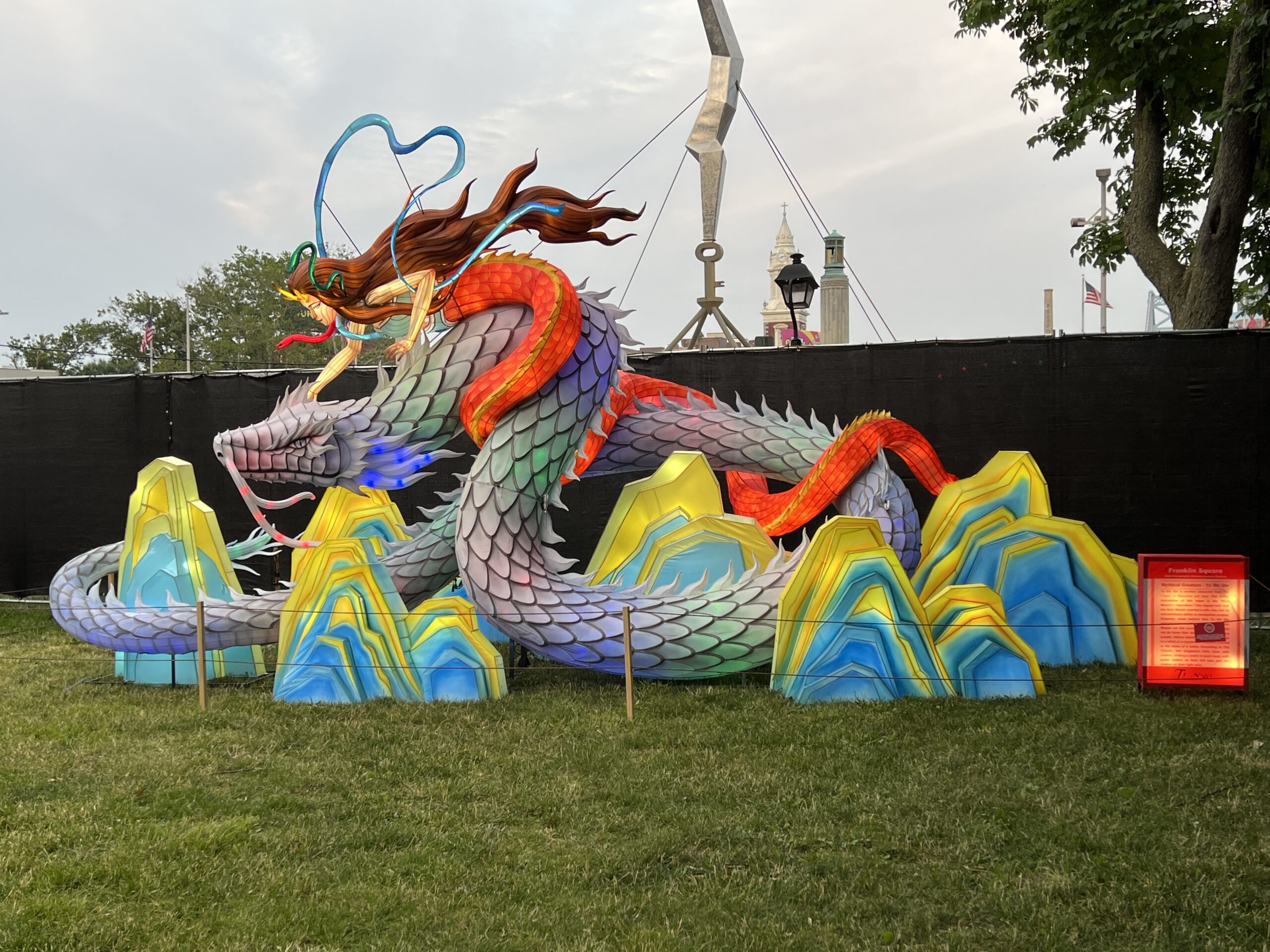 Mythical Creature Yu Shi Qie mermaid dragon at Philadelphia Chinese Lantern Festival lit up at dusk WIDE