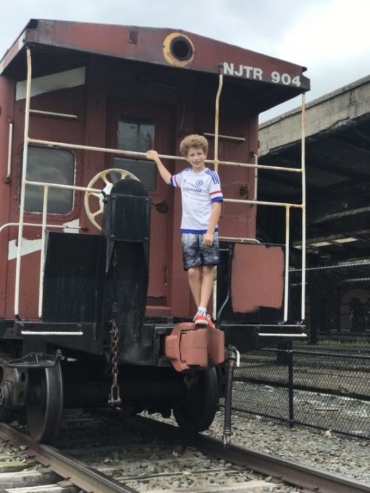 boy on train at Central Railroad of New Jersey Terminal at Liberty State Park in Jersey City