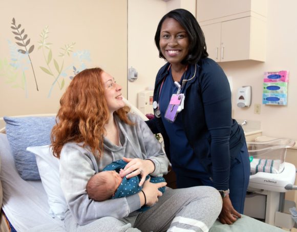 new mom with her baby and nurse at Inspira Medical Centers