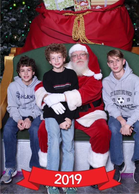 Family Christmas photo with santa at HGTV Santa HQ at the Freehold Raceway Mall