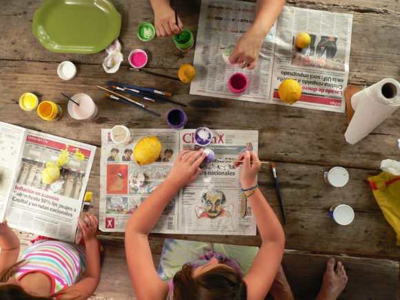 kids sitting around with DIY paint at home kits