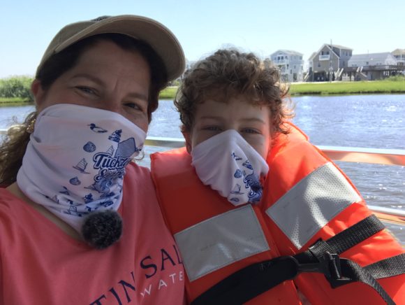 Mother and sun ride the Tuckerton Seaport LBI Ferry as part of Tuckerton staycations.