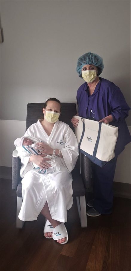 A-mom-with-her-newborn-an-Inspira-labor-and-delivery-nurse-and-an-Inspira-Maternity-Bag