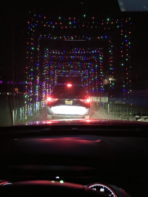 A 2021 Chevy Trailblazer drives through a tunnel of lights at the Skylands Stadium Jack O' Lantern Experience.