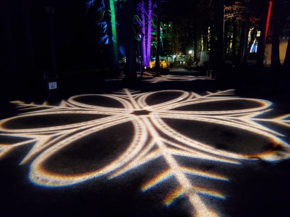 Light projects onto the pathway at Six Flags Great Adventure Holiday in the Park in New Jersey.