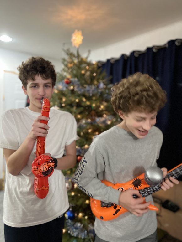 Teens singing karaoke with inflatable ornaments 1