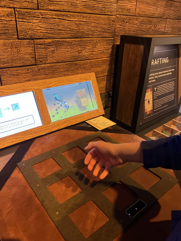 Breaking blocks station at Minecraft exhibit at Liberty Science Center