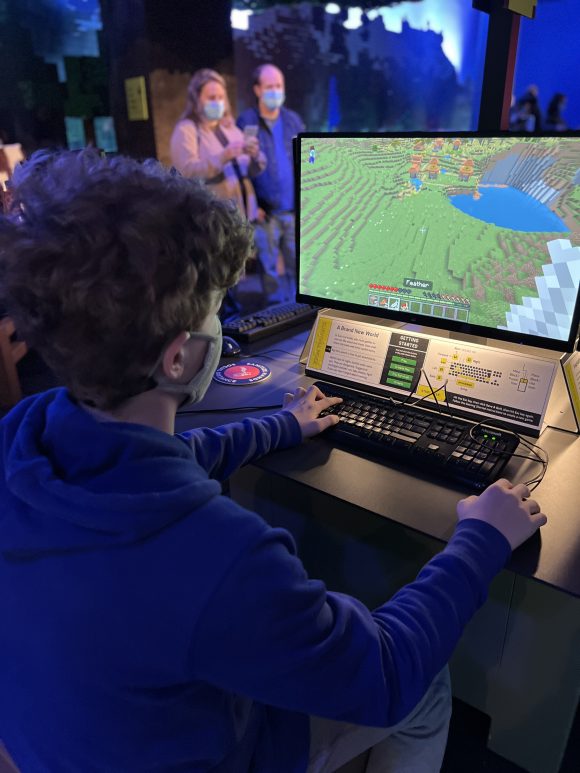 teen playing minecraft at Liberty Science Center