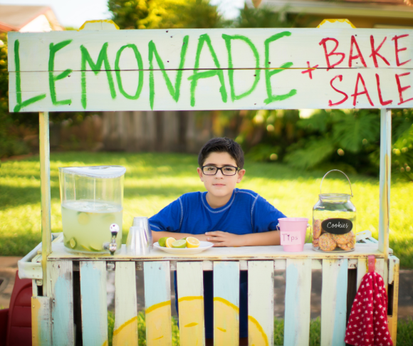 Boy holds lemonade and bake sale to raise money for charity