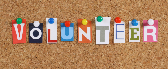 The Word volunteer on a bulletin board background