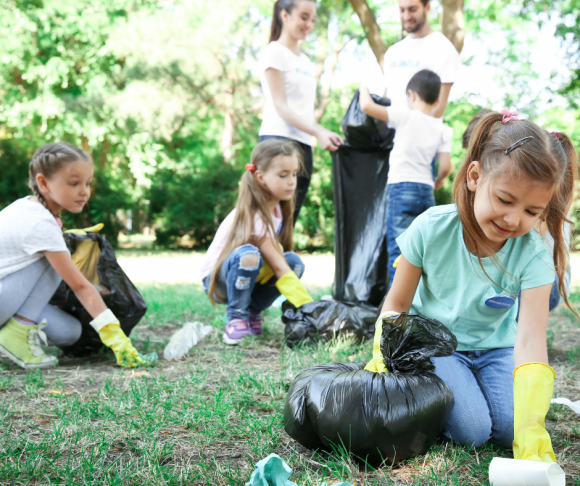 girls volunteer at a park clean up in New Jersey