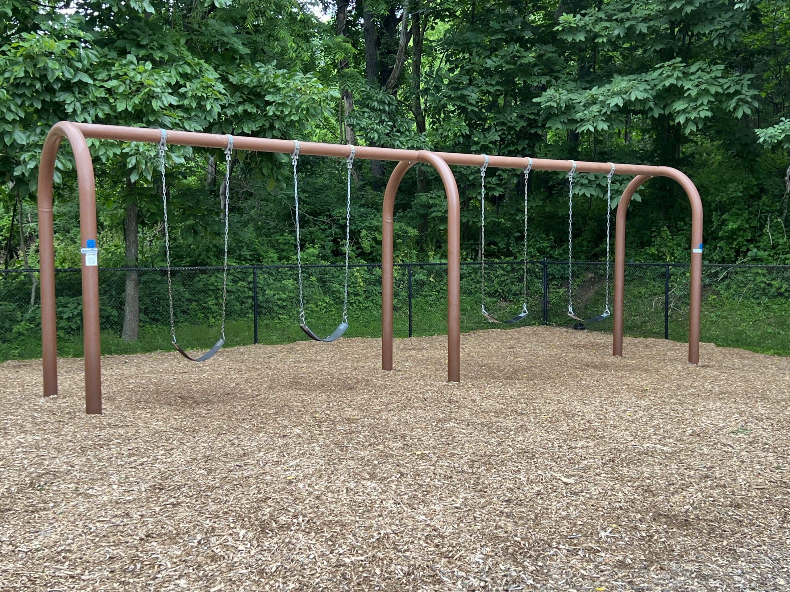 4 traditional swings at Kids Kastle Station Park Playground in Sparta NJ