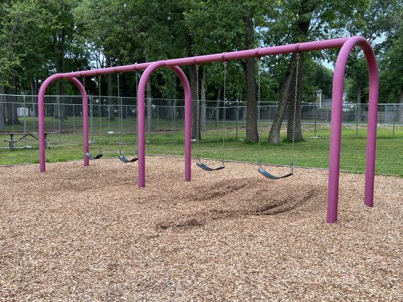 4 traditional swings at Saddle River County Park Playground in Ridgewood NJ
