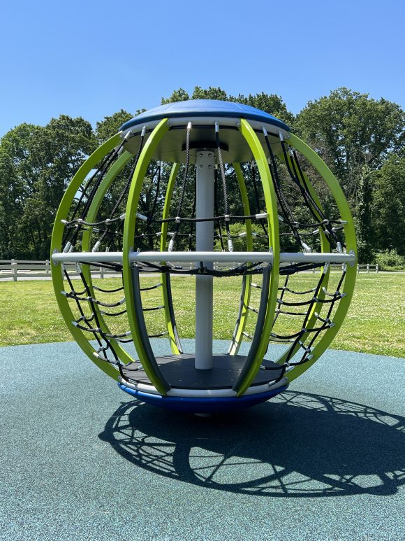 Spinning globe playground equipment at Fasola Park in Deptford New Jersey.