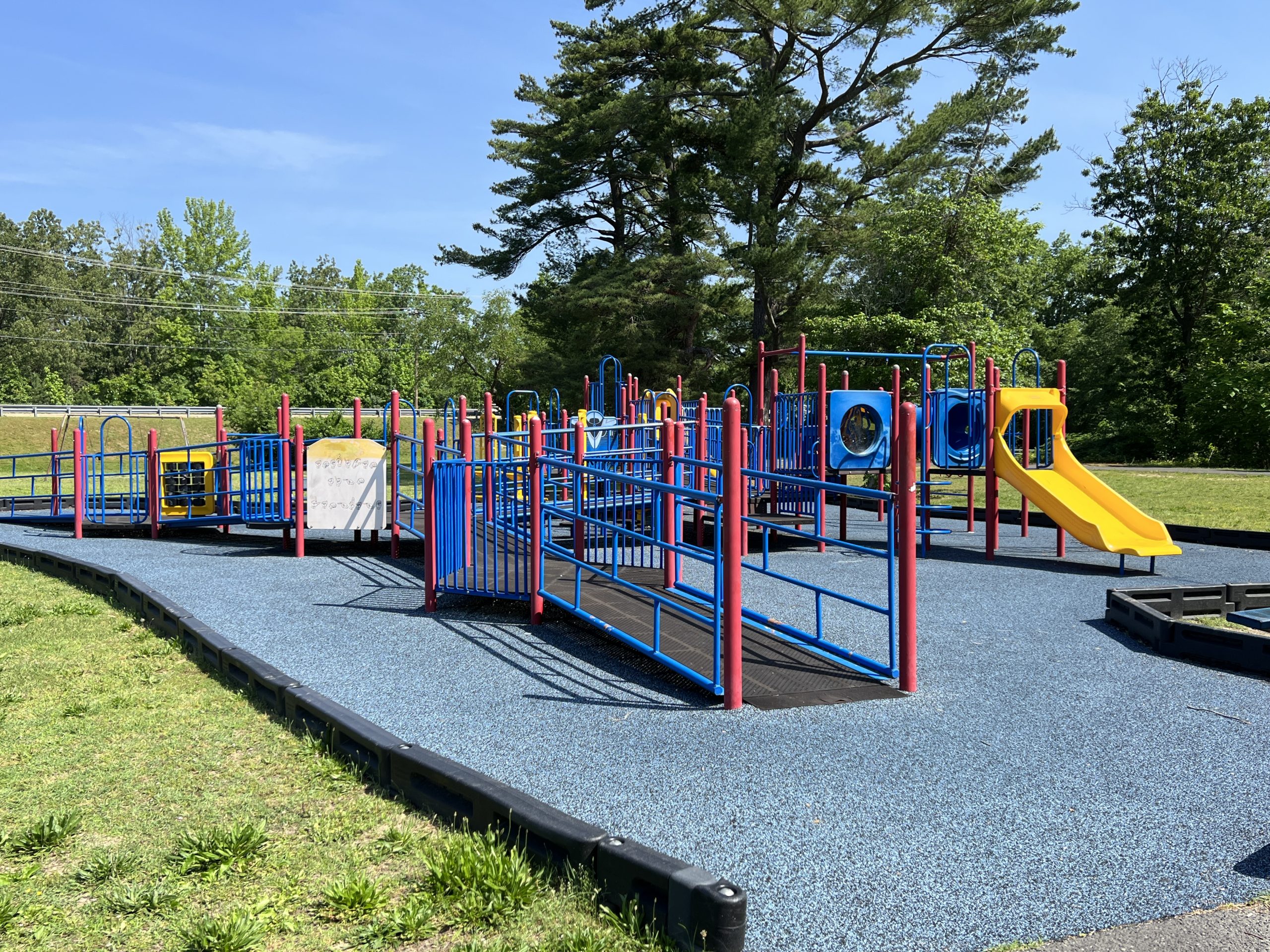Horizontal picture of Waltman Park Playground in Millville NJ with wheelchair accessible ramp