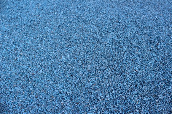 blue rubber mulch and black rubber mulch provide the ground surface for Koradigo Cove Park in Barnegat New Jersey