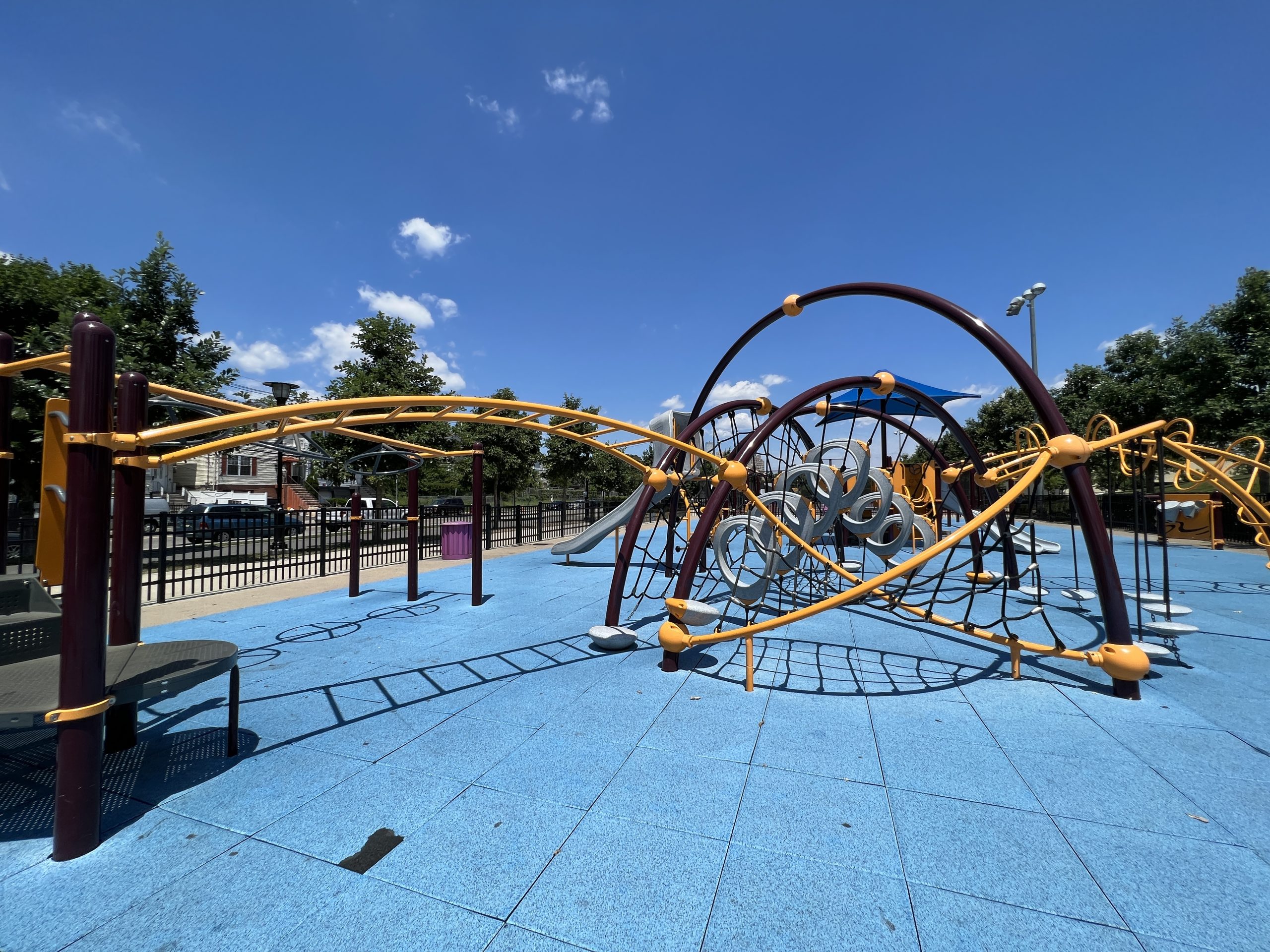 Berry Lane Park Playground in Jersey City NJ large twisting web and ladders with o ring climbers wide shot of backside 1