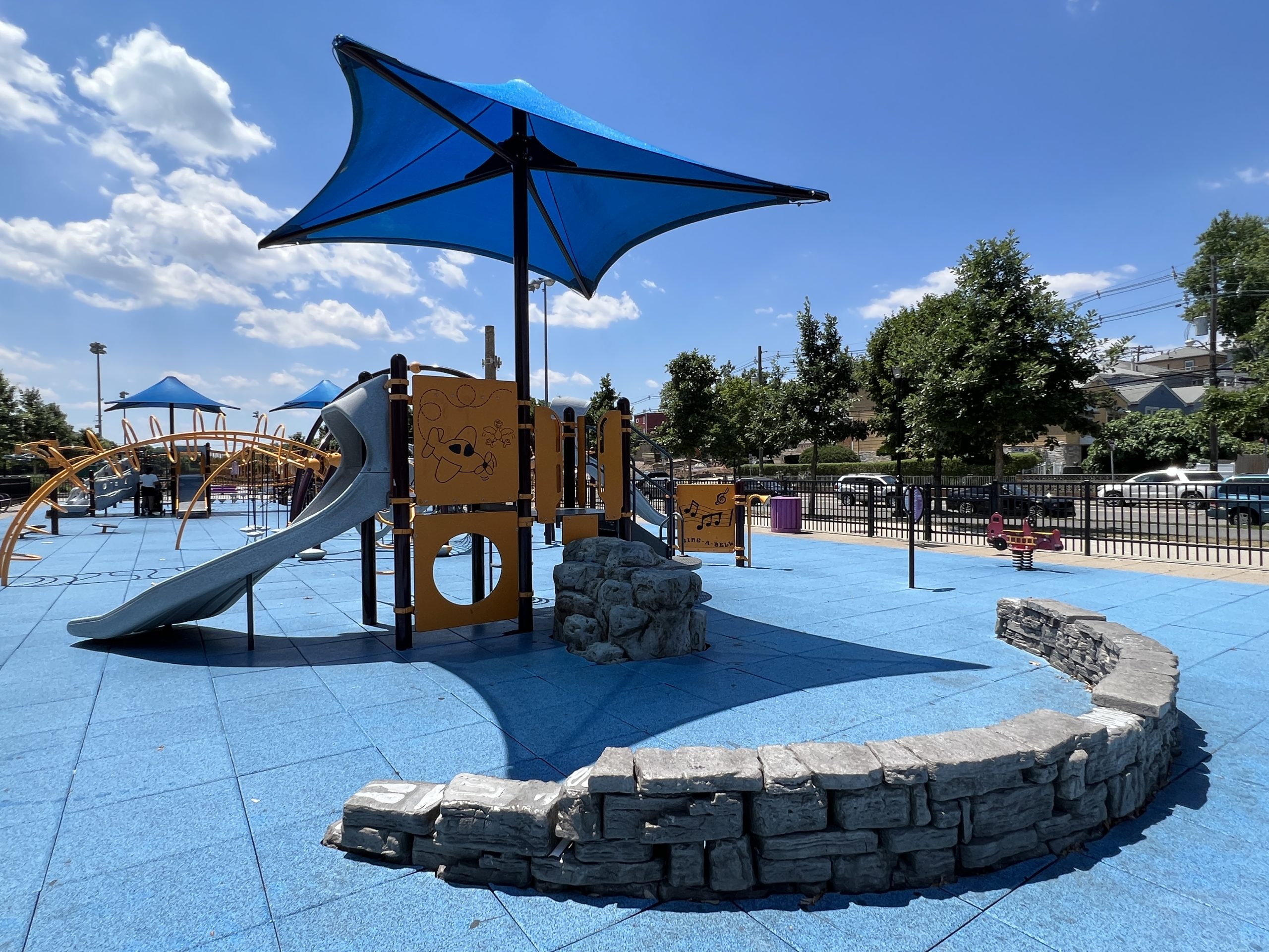 Berry Lane Park Playground in Jersey City NJ small toddler playground with canopy and slide wide shot