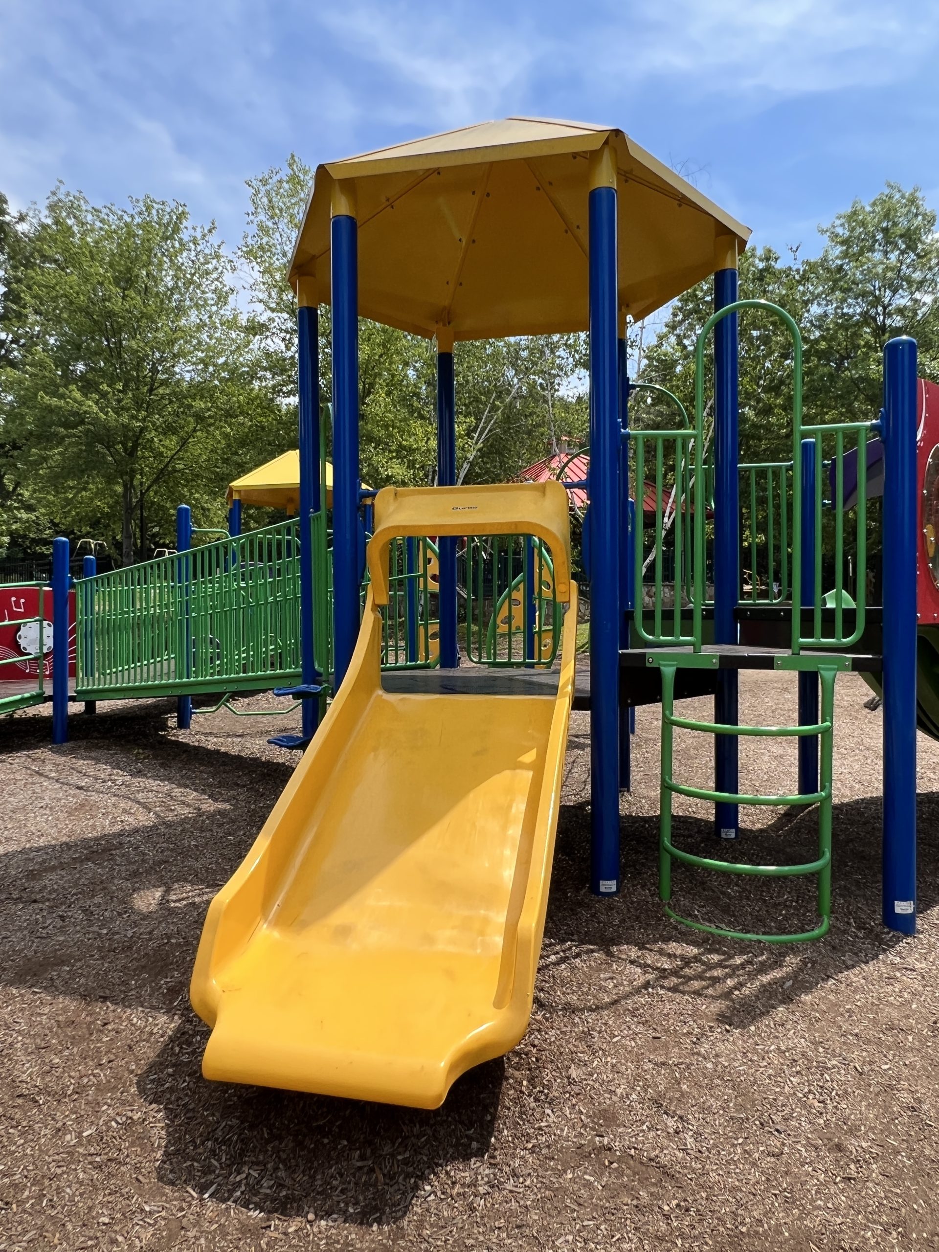 Blue and Green accessible playground SLIDE - yellow wide - at Montville Community Playground in Montville NJ