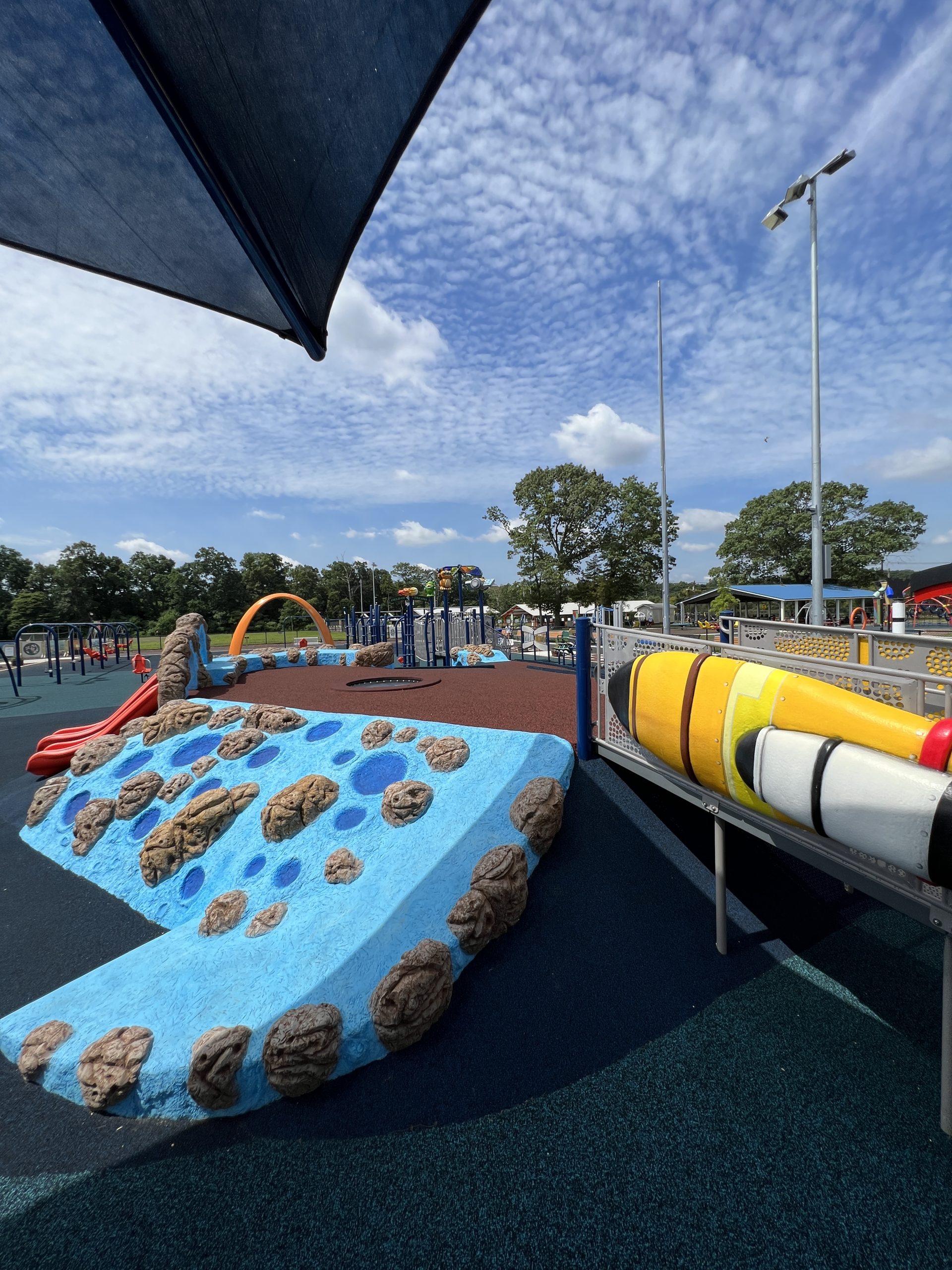 Field of Dreams Playground in Toms River NJ moon rock climbing wall with rocket and trampoline vertical