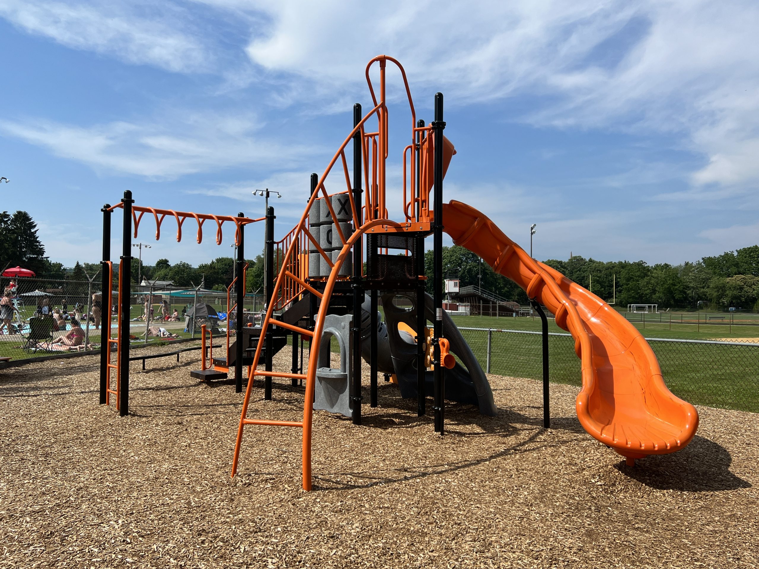 Hackettstown Community Park Playground in Hackettstown NJ horizontal picture of bigger structure with curvy slide climbing ladder money bars