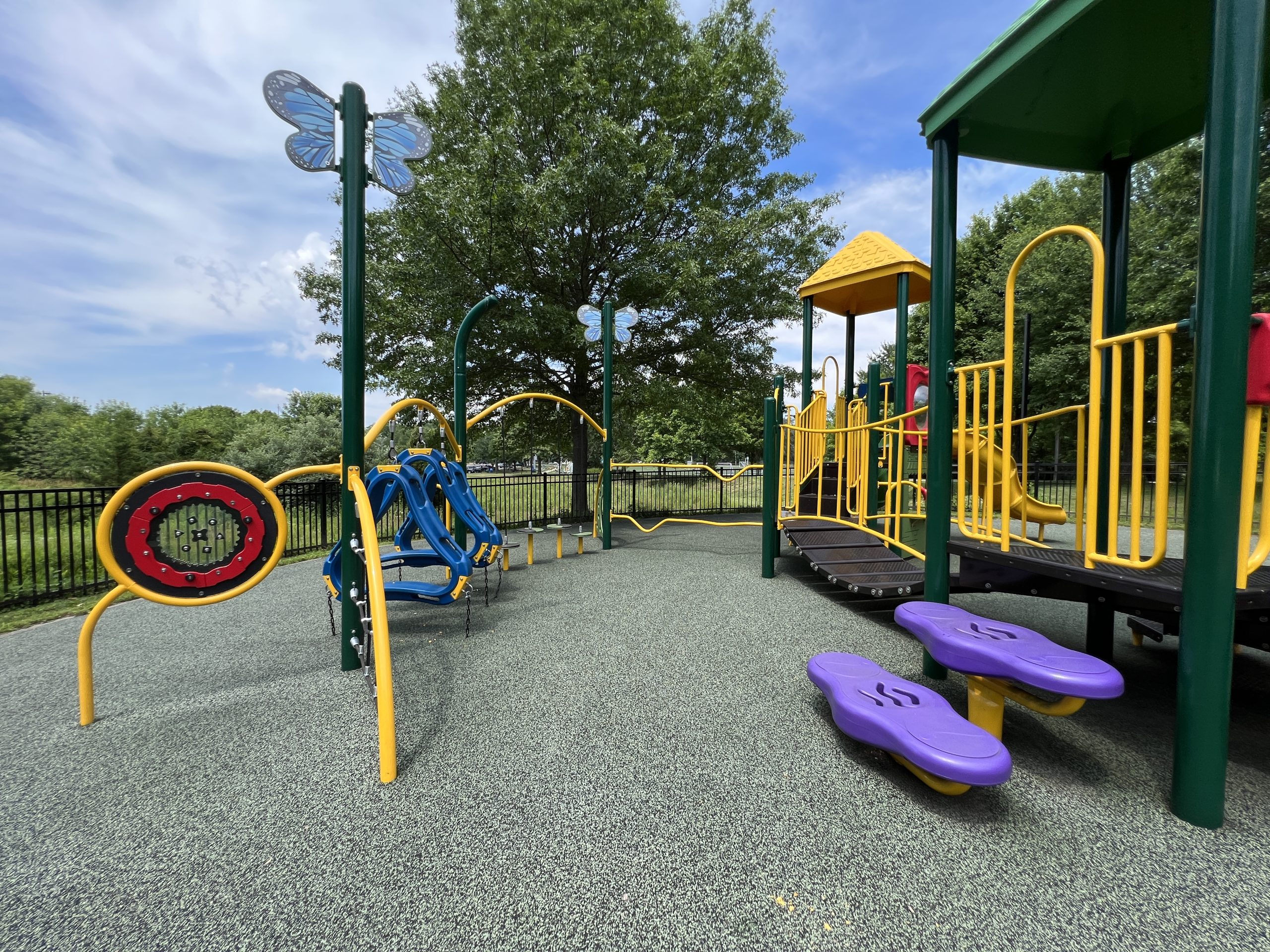 Yellow and Green playground at Montville Community Playground in Montville NJ climbing features and sensory play