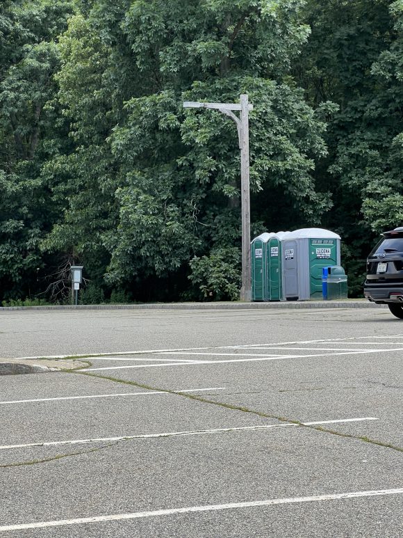 parking lot with portapotties at Montville Community Playground in Montville NJ