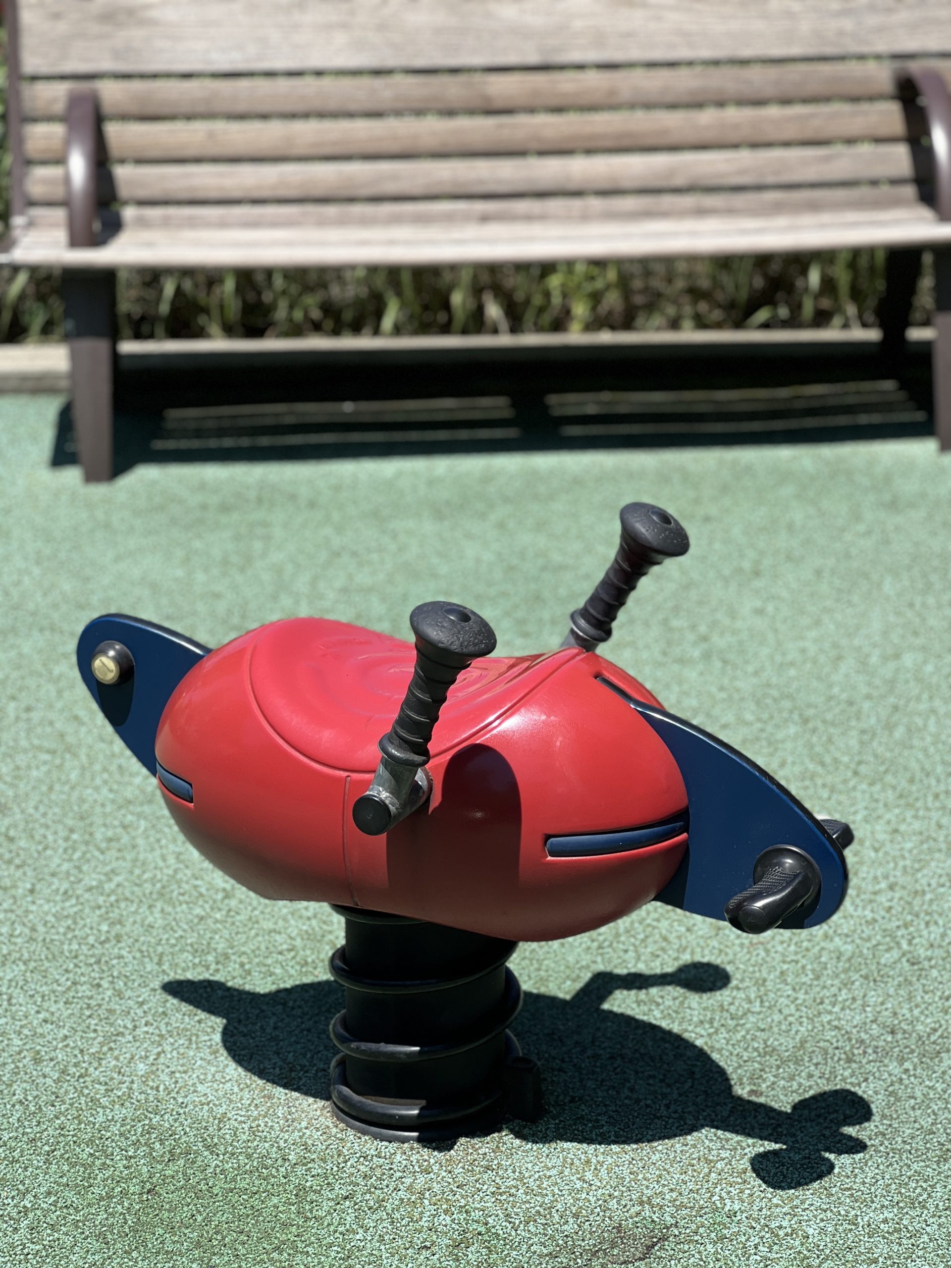 FEATURES - Ride on toy red AT Newport Green Park Playground in Jersey City NJ
