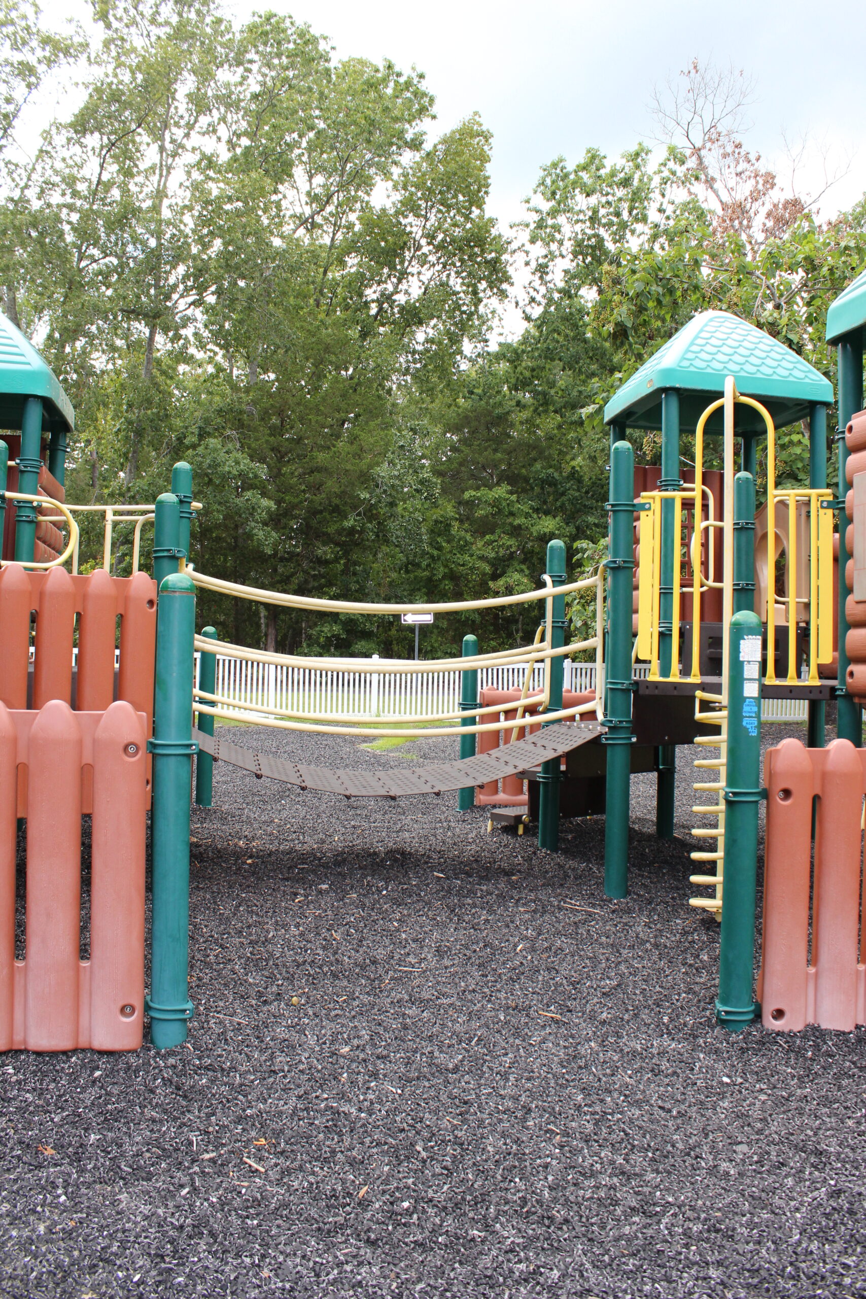 Front Estell Manor Park Playgrounds in Mays Landing NJ - Features - bridge on log cabin playground TALL image
