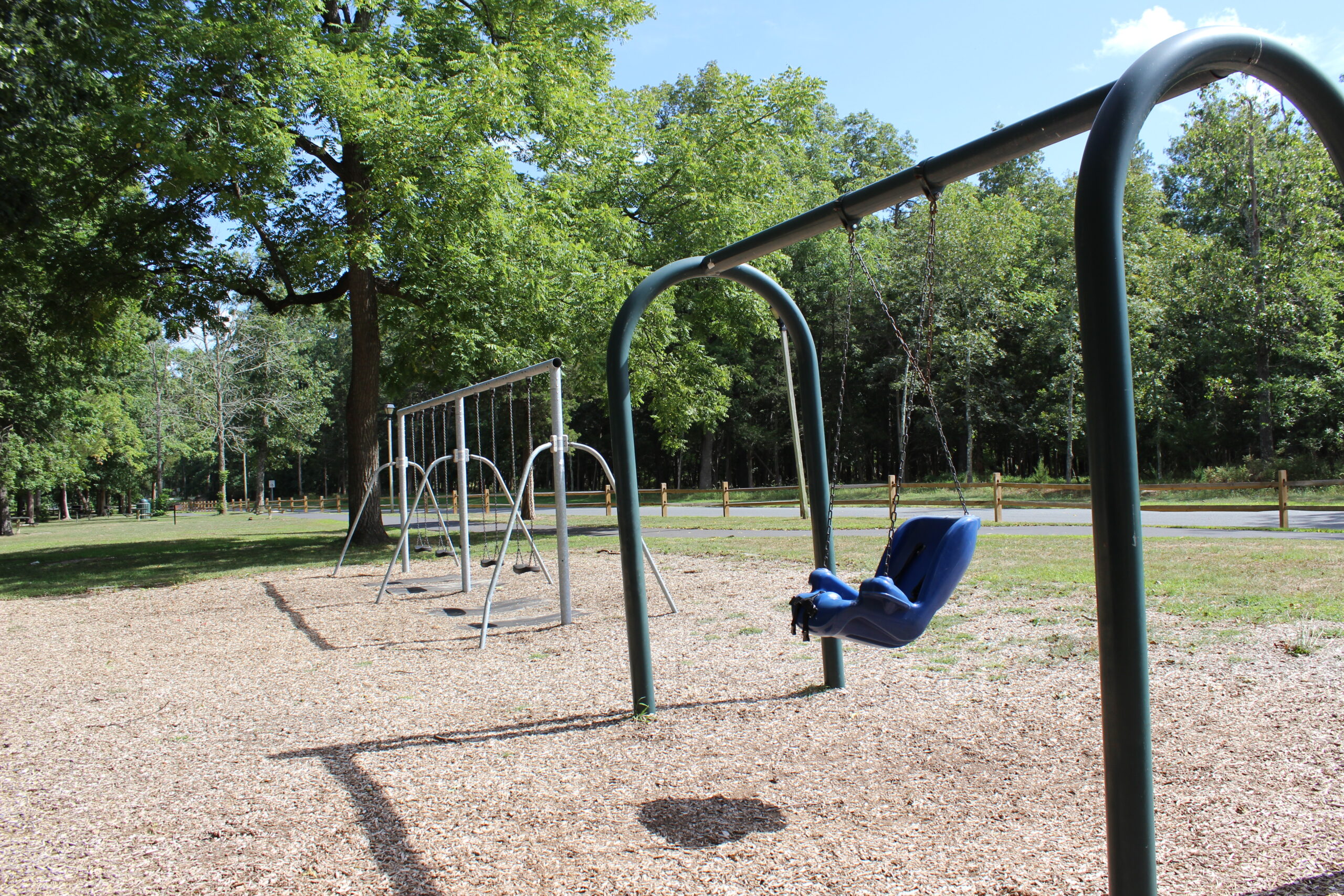 Front Estell Manor Park Playgrounds in Mays Landing NJ - SWINGS - New accessible swing in older section WIDE image