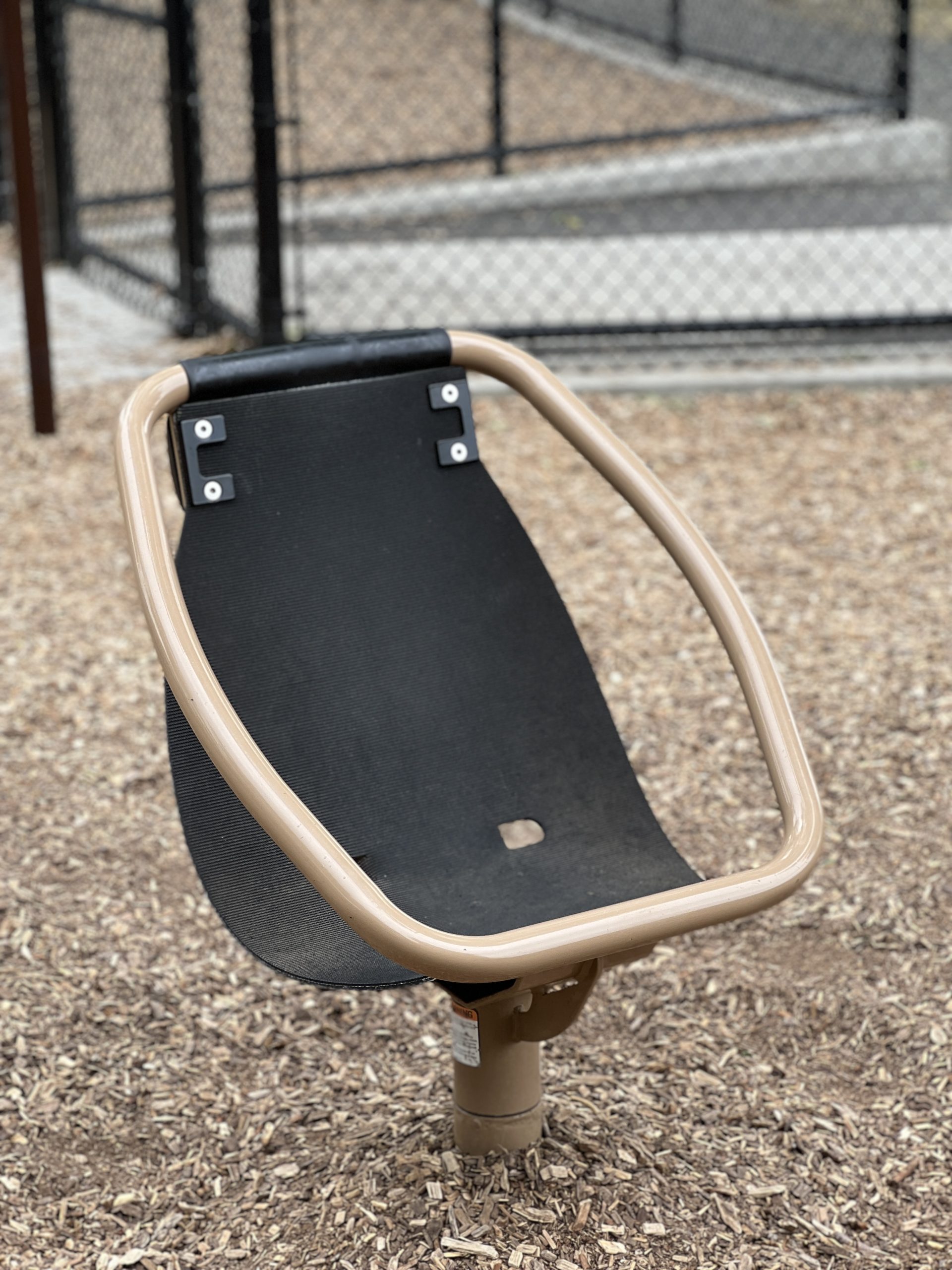 Goffle Brook Park Playground in Hawthorne NJ - Features - spinning seat TALL image