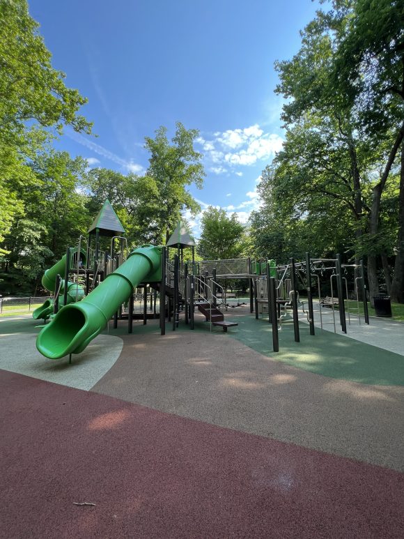 Grover Cleveland Playgrounds in Caldwell NJ - Large Playground Structure - TALL view with straight tunnel slide and monkey bar rings
