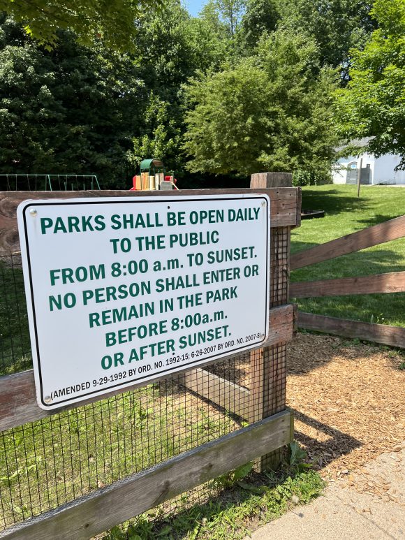 Lake Musconetcong Park Playground in Stanhope NJ - Sign with hours on fence