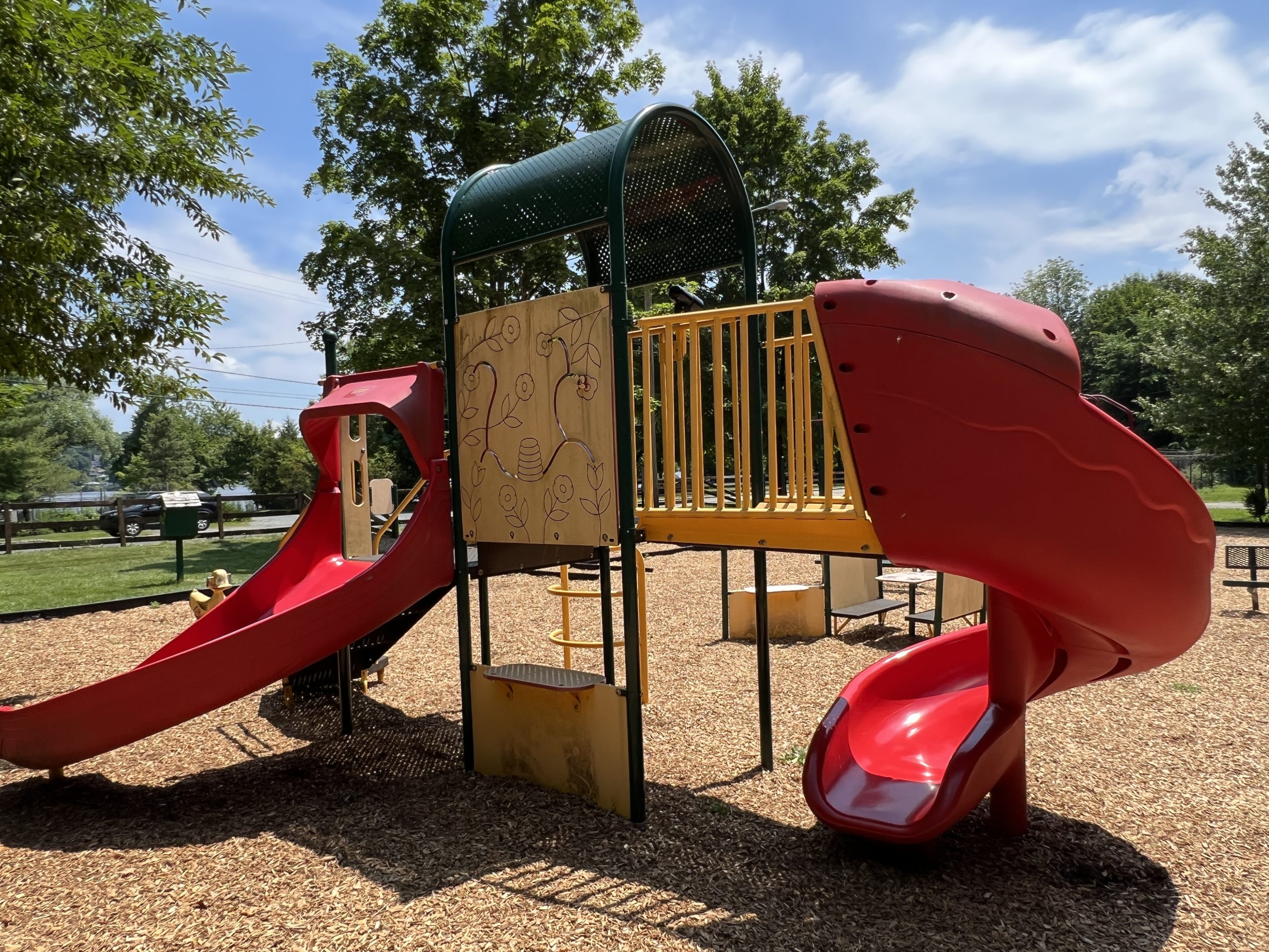 Lake Musconetcong Park Playground in Stanhope NJ - WIDE image - red slide structure flower side