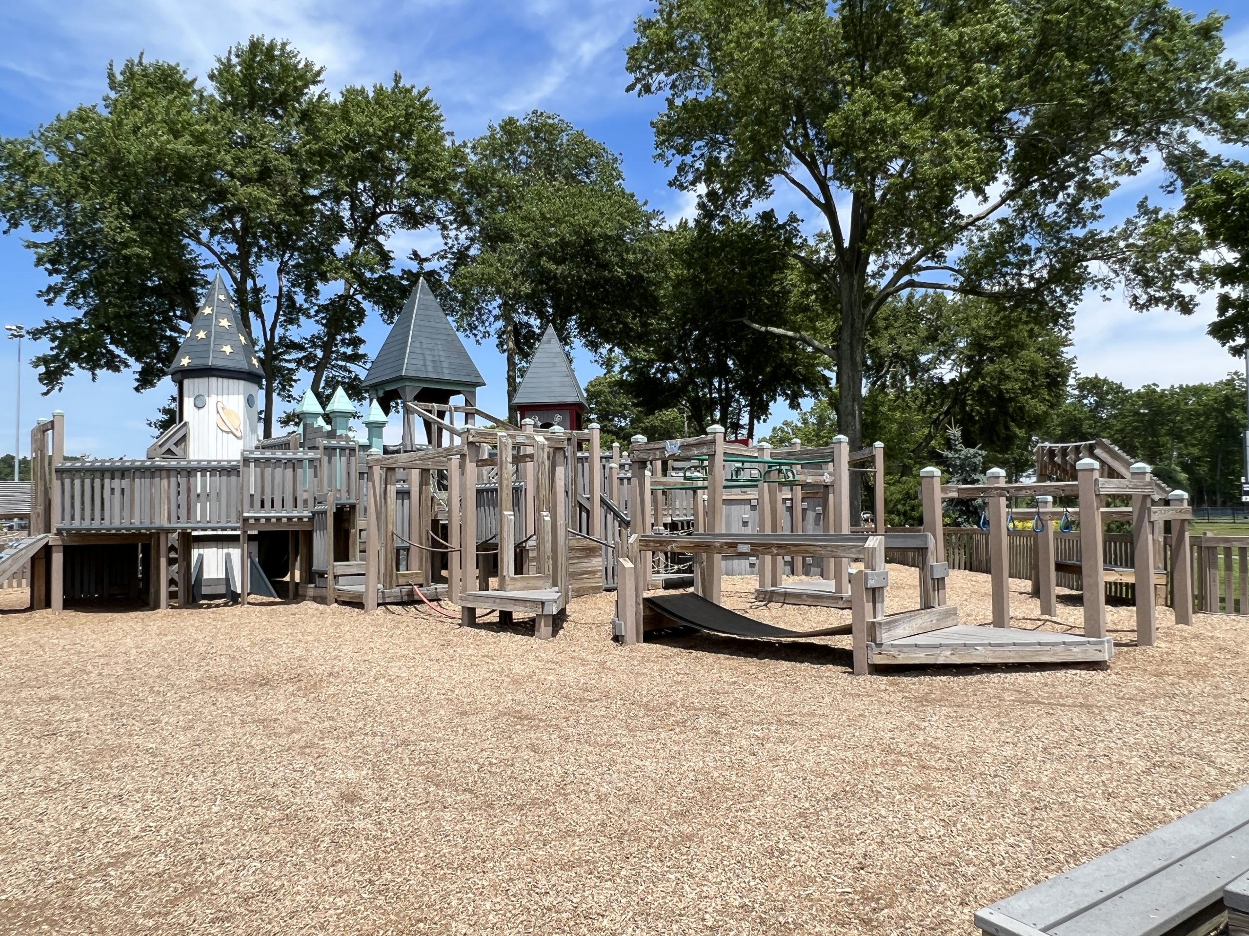 Main Playground at Imagination Station Playground in Roxbury NJ - WIDE view of back with bridges and monkey bars and rings
