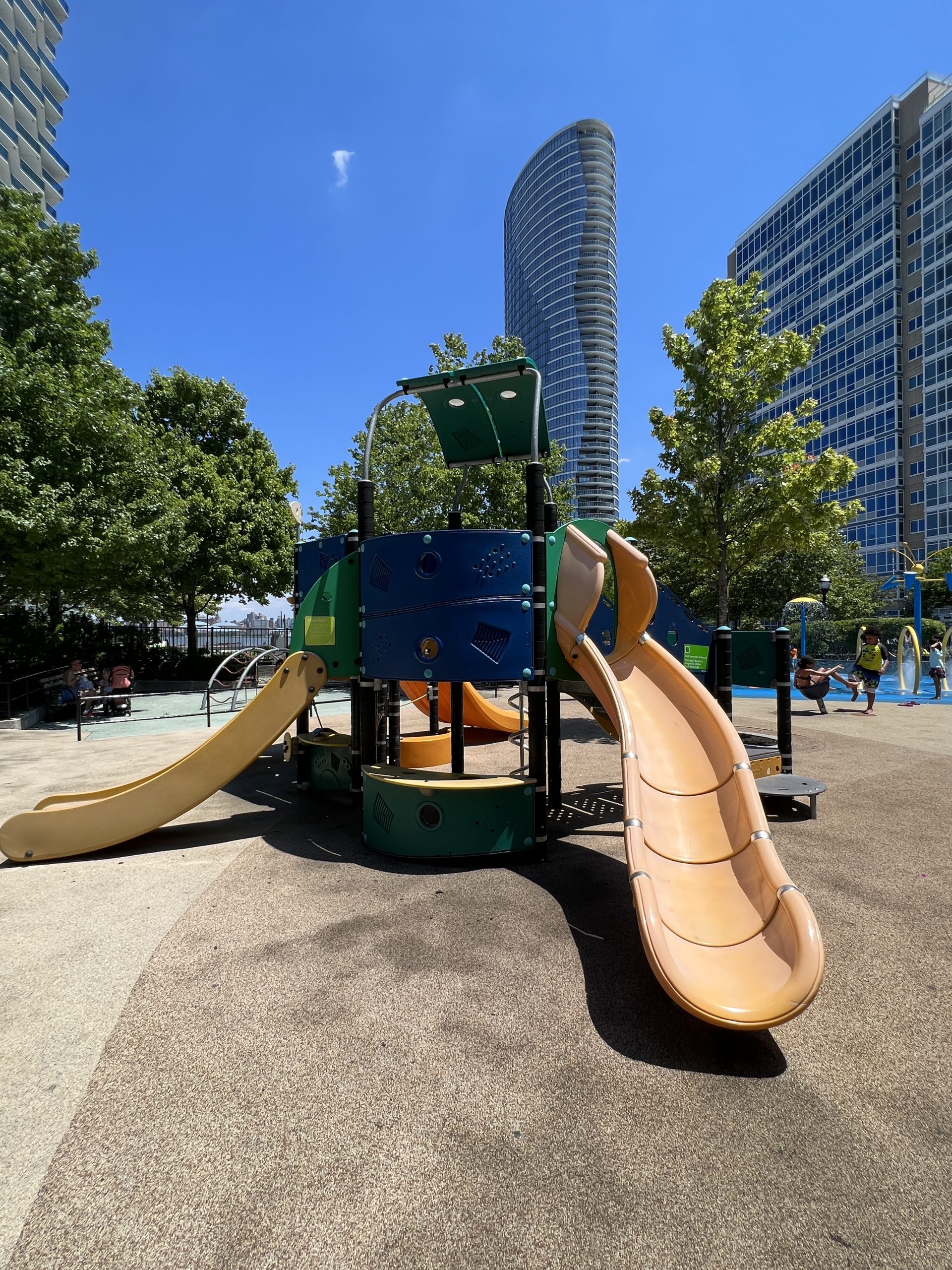 SLIDE - curvy slide at multicolor playground AT Newport Green Park Playground in Jersey City NJ