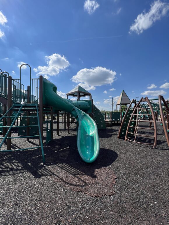 SLIDES - Big playground slightly curvy slide at Overpeck County Park Playground in Leonia NJ