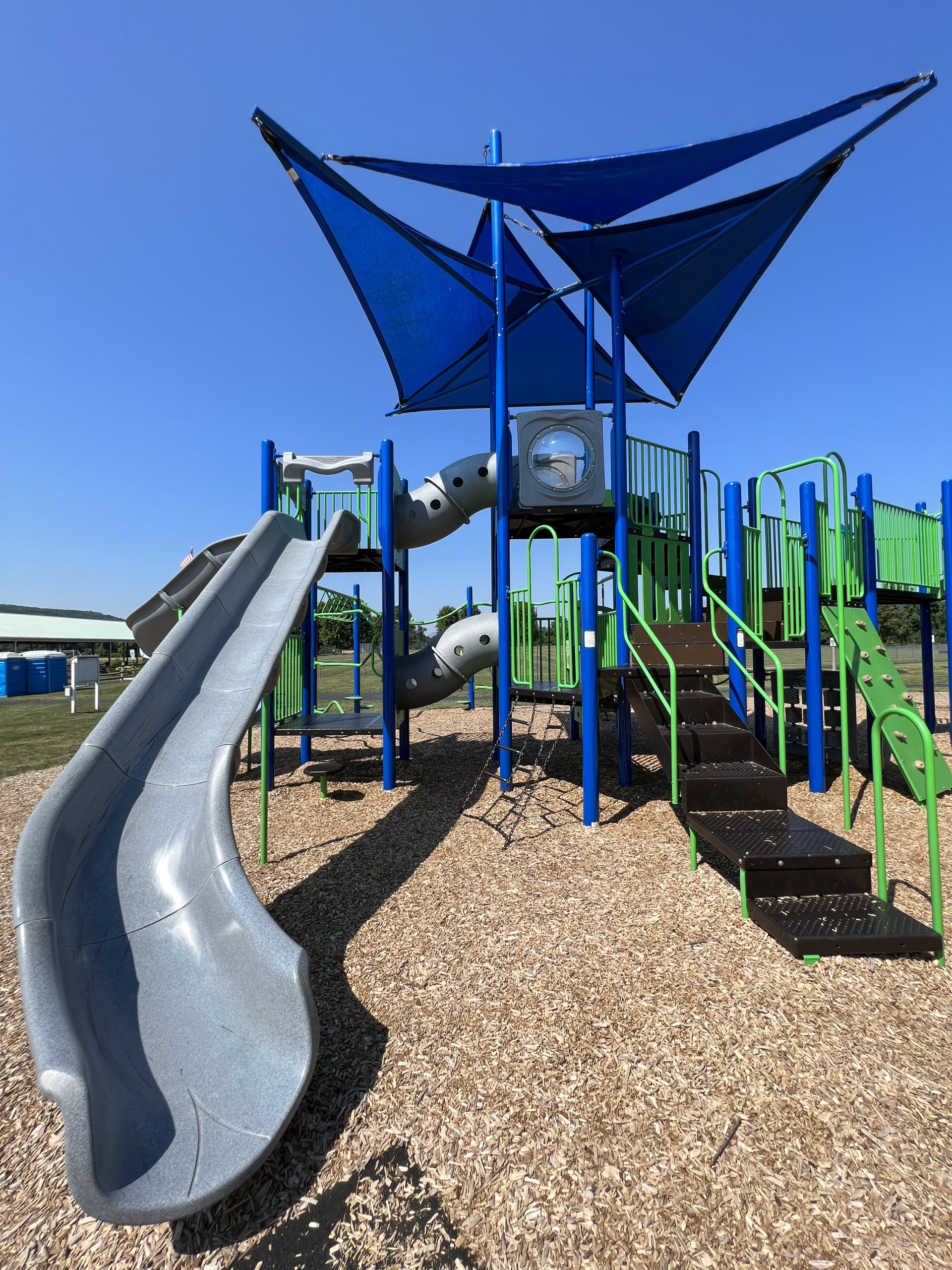 SLIDES - Open slightly curvy at bottom slide 1 At Heritage Park Playground in Asbury NJ