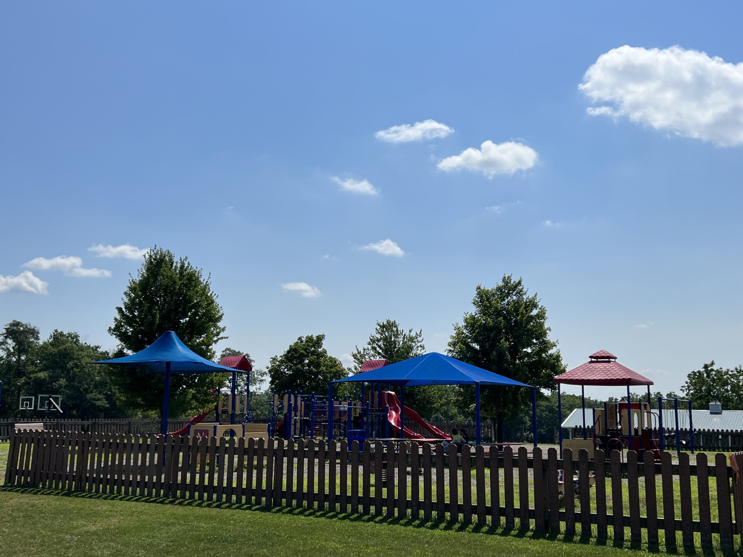 Alexandria Township Park Playground in Milford NJ - WIDE image - playground with fence around it