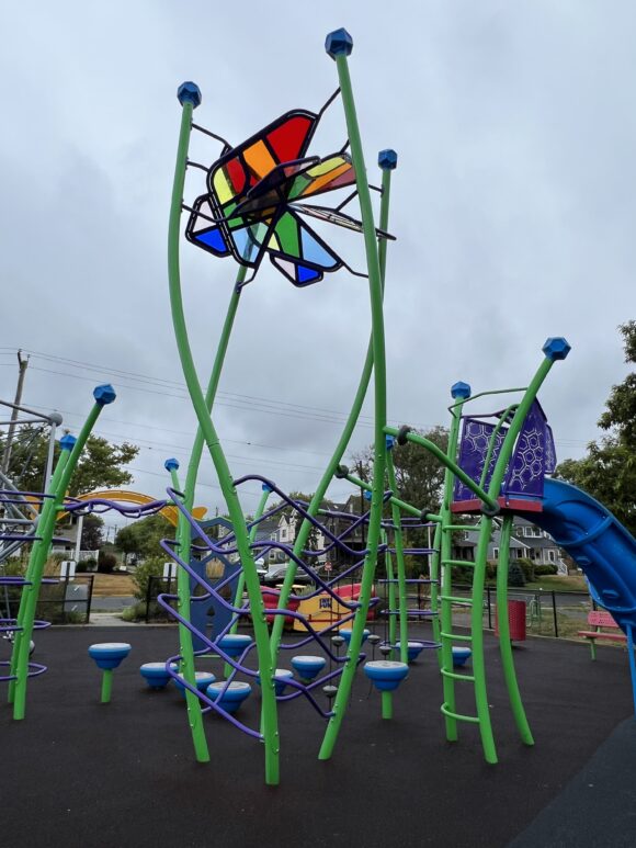 Features - green and purple climbing tower with stained glass top TALL image at Jane Magovern's Playground in Belmar NJ