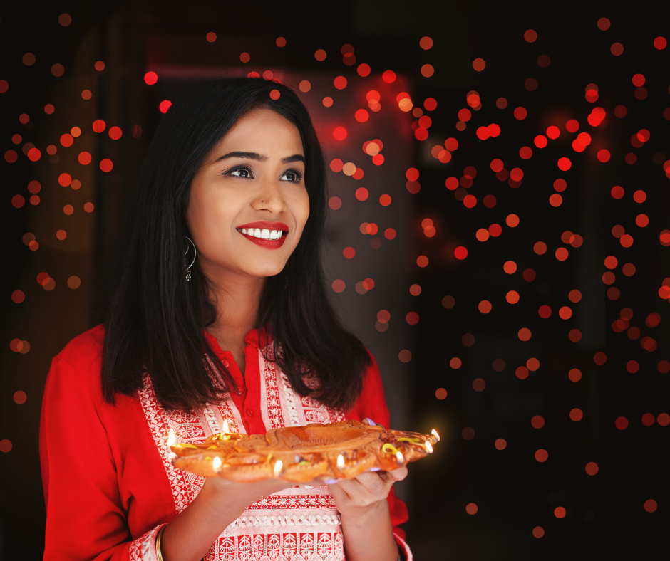 beautiful indian woman holding diya thali for Diwali celebration in New Jersey