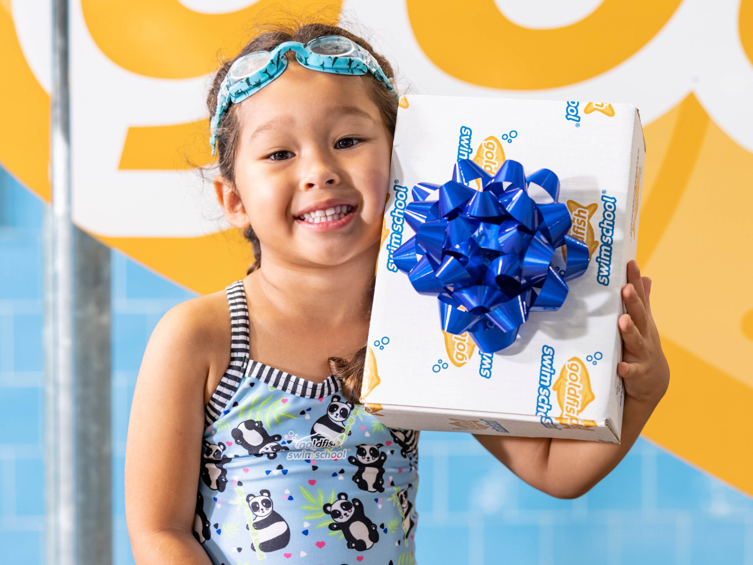 young-girl-holding-NJ-gift-experience-at-Goldfish-Swim-Schools-in-New-Jersey-2022